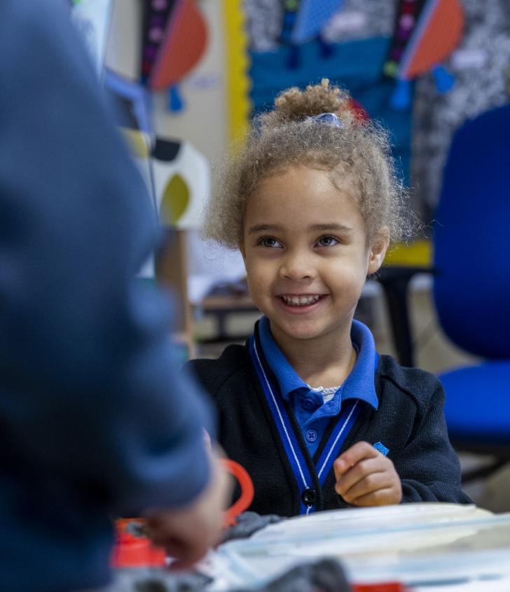  Nursery pupil enjoying a variety of different activities in the classroom 