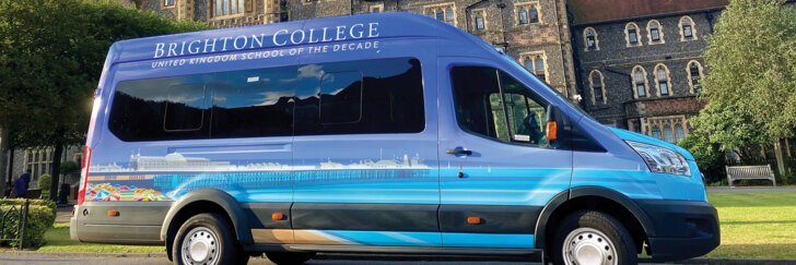  Blue Brighton College Minibus parked in the Quad 