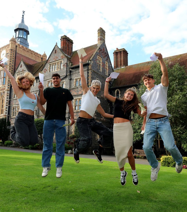  Pupils celebrating their grades on A-Level Results Day by jumping in the Quad 