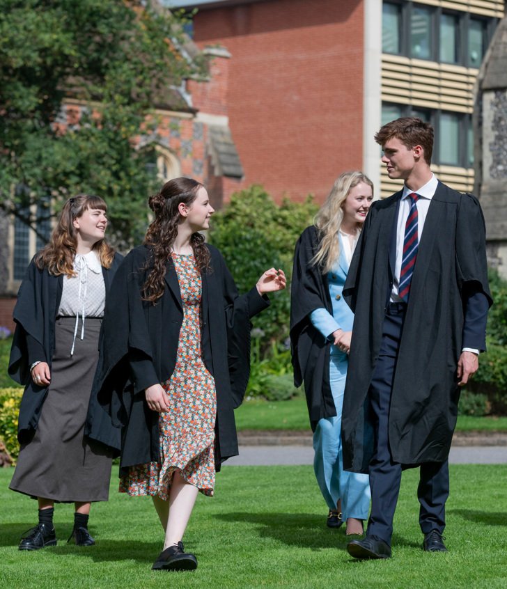  Head and Deputy Heads of School in their gowns on the lawn in the Quad 