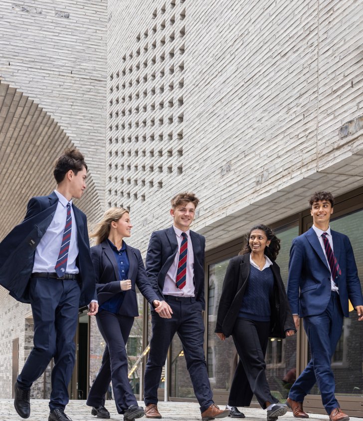  Sixth Form pupils enjoying talking to each other outside the Richard Cairns building 