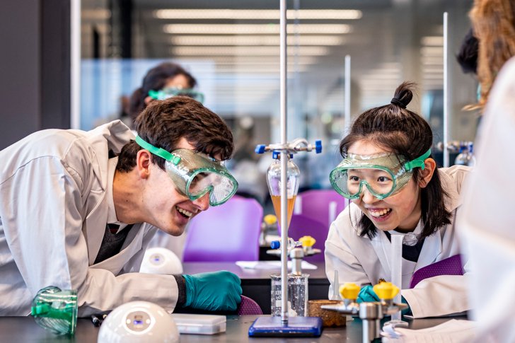  Pupils in a Chemistry lesson enjoying a titration experiment 