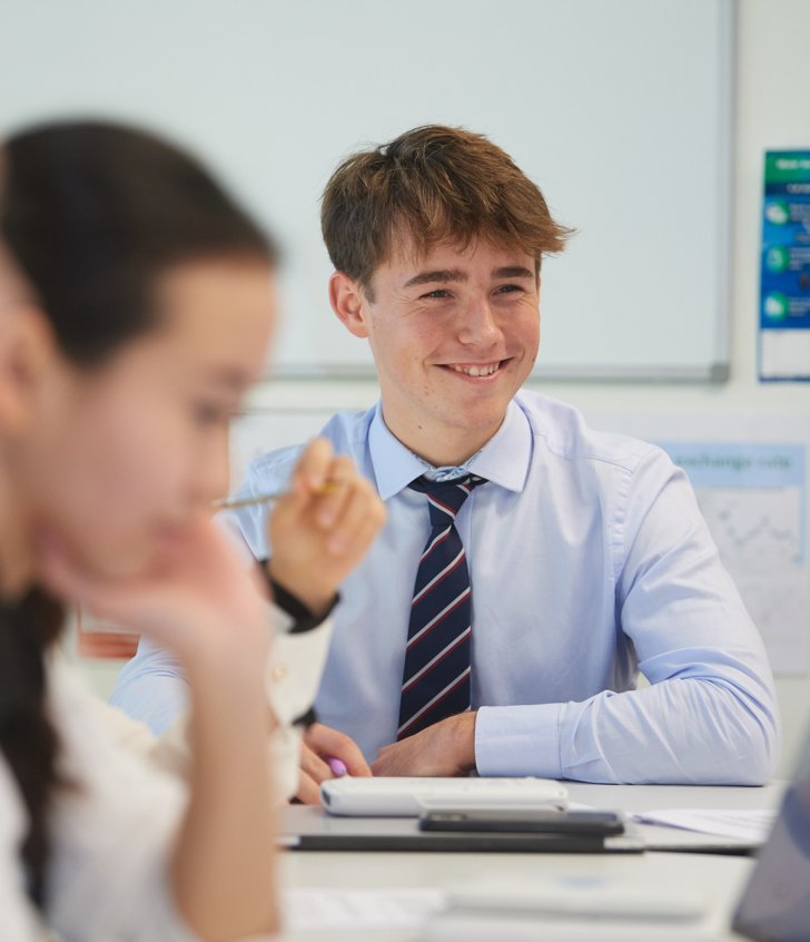  Sixth Form pupil enjoying participating in an A-Level Maths lesson 