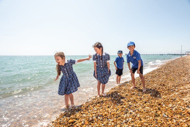  Pupils from the Pre-Prep paddling in the sea as part of Beach School 