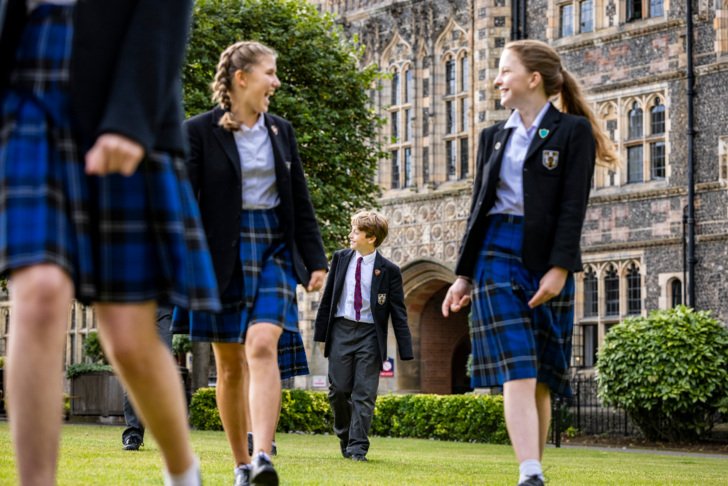  Prep School pupils happily walking through the Quad together 