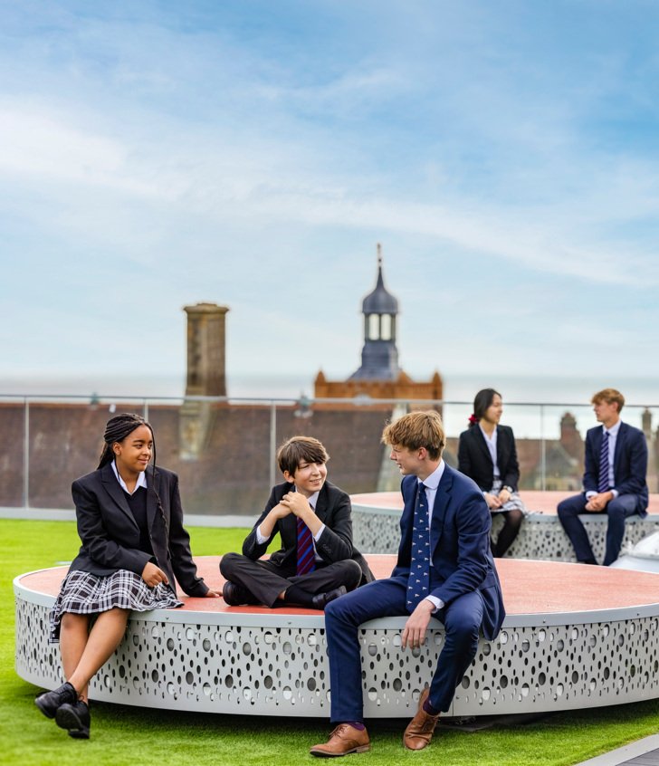  Sixth Form pupils talking to younger pupils in the Sky Garden on the roof of SSS 