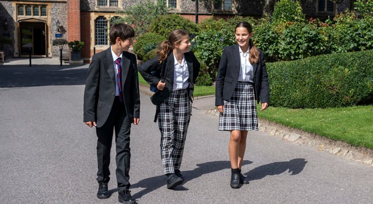  Lower School pupils enjoying talking to each other as they walk through the Quad 