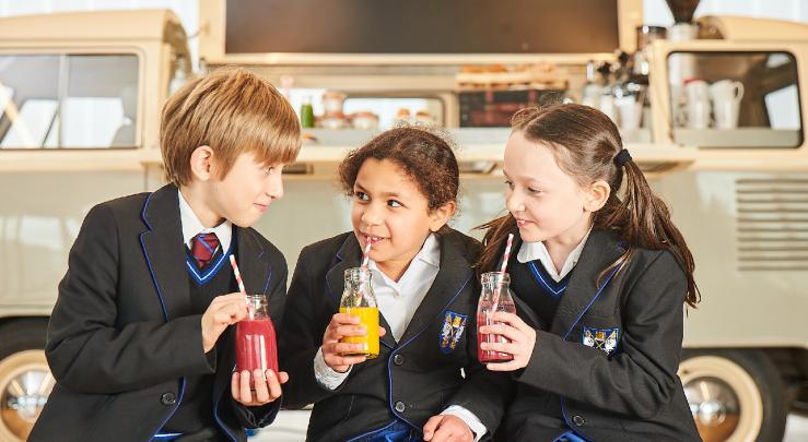  Prep School pupils enjoying drinking smoothies and chatting together in the SSS 